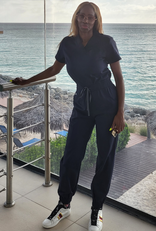 Girl in Scrub Uniform by the water